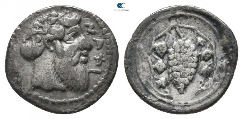 Sicily. Naxos 461-430 BC. 
Litra AR

12 mm., 0,61 g.

Head of Dionysos righ...