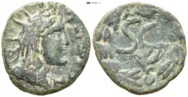 Mesopotamia. Hatra. Pseudo-autonomous issue. Time of the Antonines AD 138-192. Bronze Æ (22mm, 8.0 g) Illegible inscription. Radiate head of the sun g...