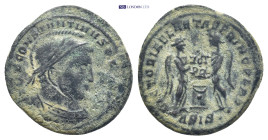 Constantine 307-337, AE (19mm, 2.6 g) Obv: Helmeted head of Constantine right "IMP CONSTANTINVS PF AVG" Rev: Two victories standing, facing eachother,...