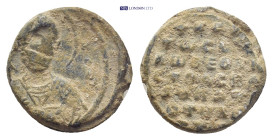 Byzantine Lead Seal (19mm, 6.76 g) Θ / N/I-K/O/Λ Nimbate facing bust of Saint Nicholas, raising his right hand in benediction and holding book of Gosp...