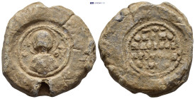 Byzantine Lead Seal (21mm, 11,8 g) Nimbate bust of the Virgin Mary, facing, between two crosses, holding a medallion of a facing head of Christ on her...