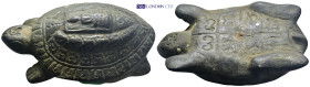 Bronze Buddhist turtle object. Embroidered with shapes and symbols on the bottom and top of its shell. Monk sitting on it in meditation. According to ...