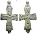 Byzantine bronze reliquary cross (enkolpion) (106mm, 165.4 g) A Byzantine bronze reliquary cross. On one side, the piece depicts a crucified Christ be...