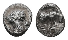 Ionia, Magnesia ad Maeandrum. AR Tetartemorion, 0.14 g 6.01 mm. Circa 400-350 BC.
Obv: Laureate head of Apollo right.
Rev: [MAΓNH]. Bull butting right...