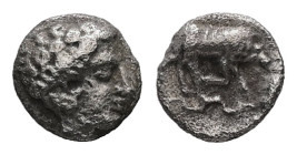 Ionia, Magnesia ad Maeandrum. AR Tetartemorion, 0.15 g 5.54 mm. Circa 400-350 BC.
Obv: Laureate head of Apollo right.
Rev: [MAΓNH]. Bull butting right...