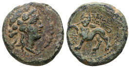 Lydia, Sardes. Ae, 4.85 g. - 18.47 mm. 2nd-1st centuries BC.
Obv.: Head of Dionysos right, wearing ivy wreath; all within dotted circle border.
Rev.: ...