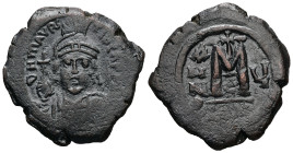 Maurice Tiberius, AD 582-602. AE, Follis. 10.77 g. 29.61 mm. 
Obv: DN MAVRIC TIBER PP. Crowned, draped and cuirassed bust facing, holding cross on glo...