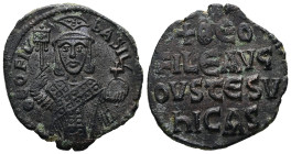 Theophilus, AD 829-842. AE, Follis. 7.01 g. 27.09 mm. Constantinople.
Obv: ΘEOFIL-bASIL. Crowned, three-quarter length figure of Theophilus facing, pe...