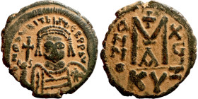 Maurice Tiberius (582-602) Follis. Obverse: Helmeted and cuirassed bust facing, holding globus cruciger and shield., Reverse: Large M above cross, ANN...