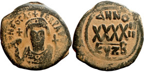 Phocas (602-610) Follis. Obverse: DN FOCA PERP AVG Crowned bust facing, wearing consular robes, holding mappa and eagle-tipped scepter , Reverse: Larg...