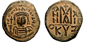 Maurice Tiberius (582-602) Follis. Obverse: Helmeted and cuirassed bust facing, holding globus cruciger and shield., Reverse: Large M above cross, ANN...