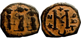 Heraclius, Martina and Heraclius Constantine (610-641). Follis. Obverse: From left, Martina, Heraclius, heraclius Constantine Reverse: Large M; cross ...