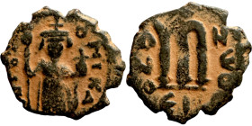 Constans II (641-668) Follis. Obverse: Imperial figure holding cross and globus Reverse: m and inscription
20mm 3,50g

Artificial sand patina