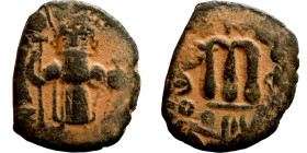 Constans II (641-668) Follis. Obverse: Imperial figure holding cross and globus Reverse: m and inscription
21mm 3,35g

Artificial sand patina