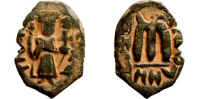 Constans II (641-668) Follis. Obverse: Imperial figure holding cross and globus Reverse: m and inscription
24mm 4,68g

Artificial sand patina