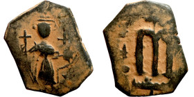 Constans II (641-668) Follis. Obverse: Imperial figure holding cross and globus Reverse: m and inscription
20mm 3,95g

Artificial sand patina