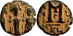 Heraclius, Martina and Heraclius Constantine (610-641). Follis. Obverse: From left, Martina, Heraclius, heraclius Constantine Reverse: Large M; cross ...