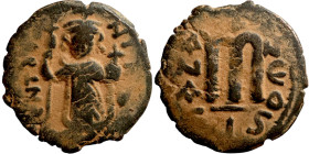 Constans II (641-668) Follis. Obverse: Imperial figure holding cross and globus Reverse: m and inscription
22mm 3,65g

Artificial sand patina