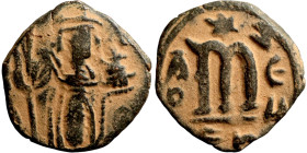 Constans II (641-668) Follis. Obverse: Imperial figure holding cross and globus Reverse: m and inscription
21mm 3,40g

Artificial sand patina