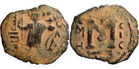 Constans II (641-668) Follis. Obverse: Imperial figure holding cross and globus Reverse: m and inscription
20mm 2,51g

Artificial sand patina