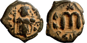 Constans II (641-668) Follis. Obverse: Imperial figure holding cross and globus Reverse: m and inscription
21mm 3,02g

Artificial sand patina