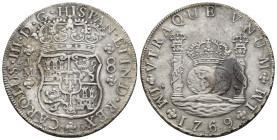 CARLOS III. 8 reales. 1769. Lima. JM. Punto sobre la L de la marca de ceca izq. Coronas reales. AR 26,15 g. 38,8 mm. VI-880; AC-1029. Oxidaciones mari...