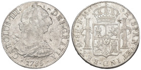 CARLOS III. 8 reales. 1785. México. FM. AR 26,83 g. 37,6 mm. VI-950; AC-1127. Resellos orientales. MBC/MBC+.