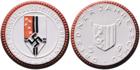 Medaillen und Abzeichen. 
Porzellanmedaille 1939 Kolonialausstellung Dresden, Meissen, weiß, mit hellbraunem Rand und mehrfarbigem Wappen. Scheuch&nb...