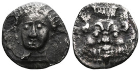 GreekCilicia, Uncertain AR obol (Silver) ca. 4th century BC .Obv: Head of female (Arethusa?) facing slightly left.Rev: Facing head of Bes.Ref: SNG BN ...