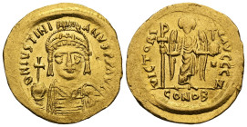 Justinian I, 527-565. Solidus (Gold), Thessalonica, 562-565. D N IVSTINIANVS P P AVI Diademed, helmeted and cuirassed bust of Justinian facing, holdin...
