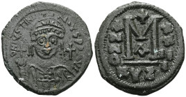 Justinian I, 527-565. Follis (Bronze), Cyzicus, Regnal year 14 = 540-541. D N IVSTINIANVS P P AVG Helmeted and cuirassed bust of Justinian facing, hol...