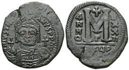 ByzantineJustinian I (527-565) AE Follis (Bronze) Antioch.Obv: DN IVSTINIANVS PP AVG, helmeted and cuirassed bust facing, holding cross on globe and s...