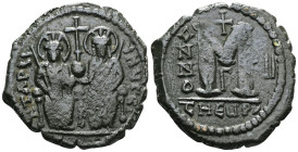 ByzantineJustin II, with Sophia (565-578) AE follis (Bronze) Theoupolis (Antioch) mint Dated RY 7 (571/572).Obv: Justin and Sophia seated facing on do...