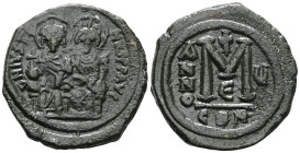 Byzantine coinsJustin II (565-578) AE Follis (Bronze) Constantinople, year 5 (569/570)Obv: Justin, holding cross on globe, and Sophia, holding crucifo...