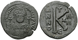JUSTINIAN I (527-565). Half Follis. Constantinople.Obv: D N IVSTINIANVS P P AVG.Helmeted and cuirassed bust facing, holding globus cruciger and decora...