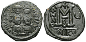 Justin II and Sophia, AE, Follis. (Bronze) Nicomedia. 565-578 AD.Obv: DN IVSTI[NVS PP] AV[G], Justin II and Sophia nimbate and seated on lyre-backed t...