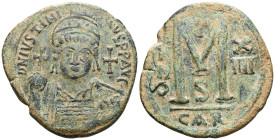 Justinian I, 527-565. Follis (Bronze), Carthage, RY 14 = 540/1. D N IVSTINIANVS P P AVC Helmeted, diademed and cuirassed bust of Justinian I facing, h...