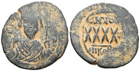 ByzantinePhocas, AE, follis, (Bronze) Nicomedia. 602-610 AD. Obv: [DN FOCAS PERP AVG], crowned, mantled bust facing, holding mappa and cross, cross in...