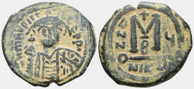 ByzantineMaurice Tiberius, 582-602. Follis (Bronze), Nicomedia, RY 20 = AD 601/2. Crowned facing bust of Maurice Tiberius, wearing crown surmounted wi...