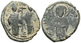 Constantine X Ducas, AE, Follis (Bronze) Constantinople. 1059-1067 AD.Obv: + EM[MA] NO[VHA], Christ standing facing on footstool, wearing nimbus and h...