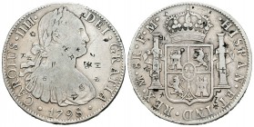 Carlos IV (1788-1808). 8 reales. 1798. México. FM. (Cal-692). Ag. 26,67 g. Resellos orientales. BC+. Est...65,00.