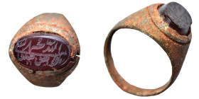 Islamic. Bronze ring with stone (8.68 g). Sold as seen.