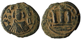 Umayyad Caliphate. temp. Mu'awiya I ibn Abi Sufyan (AH 41-60 / AD 661-680). Arab-Byzantine type, Hims.
AE Fals (22mm, 3,16g)