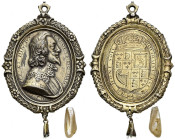 Gilt AR Badge (41x58mm, 17.23 g, 12h). By T. Rawlins. CAROLVS · D · G · MAG BRI FR · ET · HIB · REX engraved around border, armored and draped bust ri...
