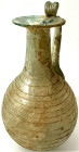 Ausgrabungen

Rom

Objekte aus Glas

Einhenklige Glasvase, 1.-3. Jh. n. Chr. Runder, bauchiger Korpus mit Rillenmuster. Höhe 15 cm. Sehr feine A...