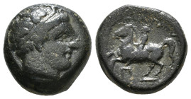 KINGS OF MACEDON. Philip II (359-336 BC). Ae Unit. Uncertain mint in Macedon.
Obv: Diademed head of Apollo right.
Rev: ΦΙΛΙΠΠΟΥ.
Naked youth on horse ...