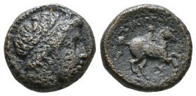 KINGS OF MACEDON. Philip II (359-336 BC). Ae.
Obv: Diademed head of Apollo right.
Rev: ΦIΛIΠΠOY.
Youth on horseback right. Control: spear-head below. ...