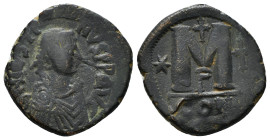 JUSTINIAN I (527-565). Follis. Constantinople.
Obv: D N IVSTINIANVS P P AVG.
Diademed, draped and cuirassed bust right.
Rev: Large M; cross above; sta...