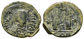 JUSTINIAN I (527-565). Follis. Constantinople.
Obv: D N IVSTINIANVS P P AVG.
Diademed, draped and cuirassed bust right.
Rev: Large M; cross above; sta...