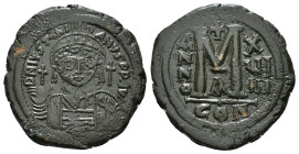 JUSTINIAN I (527-565). Follis.
Obv: D N IVSTINIANVS P P AVG.
Helmeted and cuirassed bust facing, holding globus cruciger and shield decorated with hor...